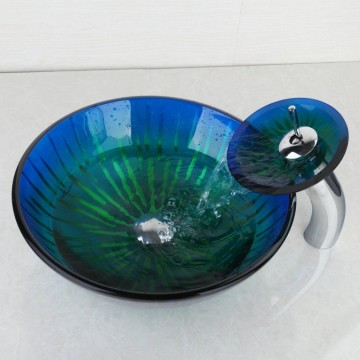 Luxe watervalkraan chroom met glazen mond en stijlvolle blauwe glazen waskom.