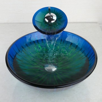 Luxe watervalkraan chroom met glazen mond en stijlvolle blauwe glazen waskom.